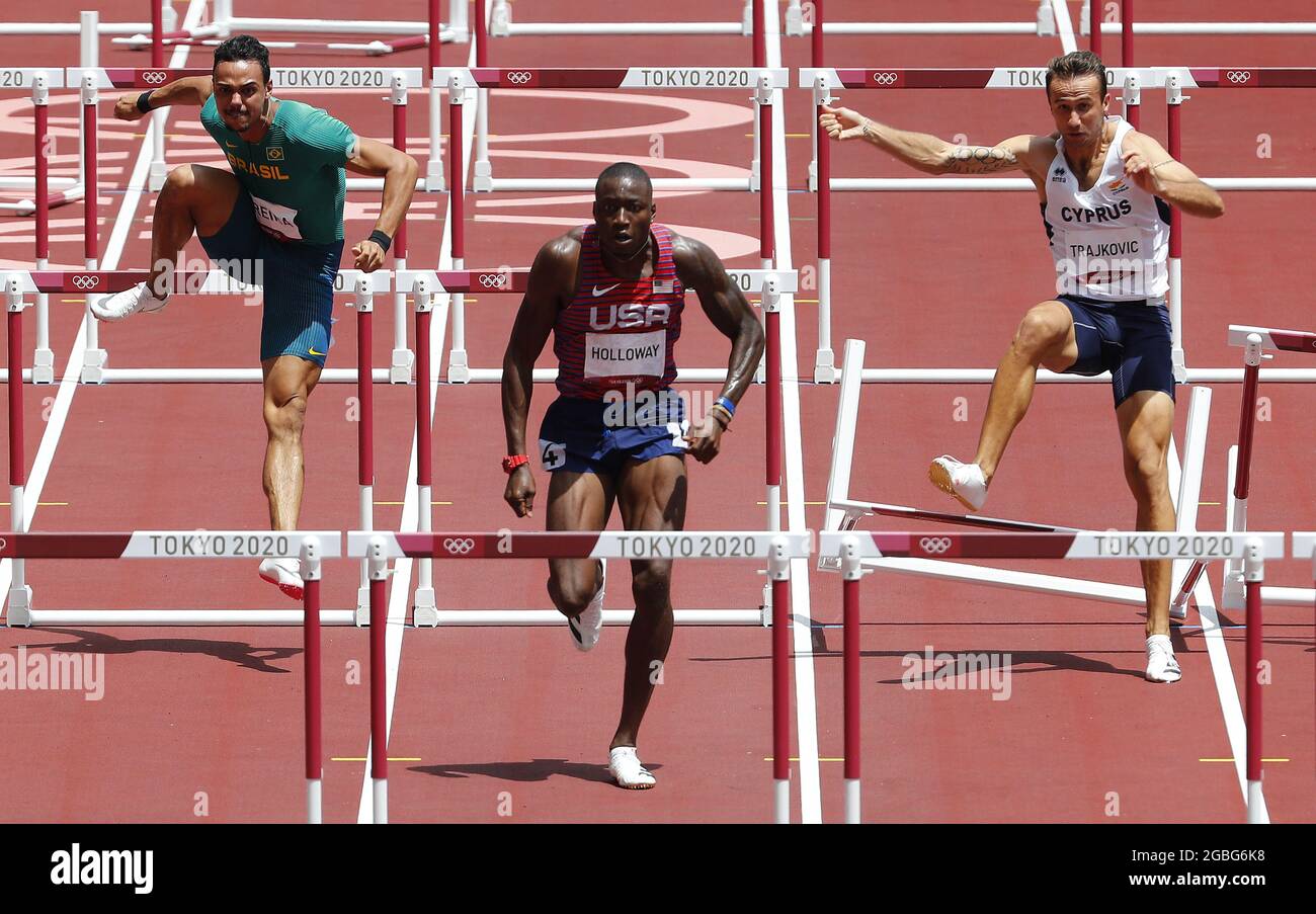 Tokyo, Japan. 04th Aug, 2021. Milan Trajkovic of Cyprus (R) trips over a hurdle as Grant Holloway of the USA (C) and Brazil's Rafael Pereira compete in the Men's 110m Hurdles semifinals at the Athletics competition during the Tokyo Summer Olympics in Tokyo, Japan, on Wednesday, August 4, 2021. Holloway won the race and advances to the finals. Photo by Bob Strong/UPI. Credit: UPI/Alamy Live News Stock Photo