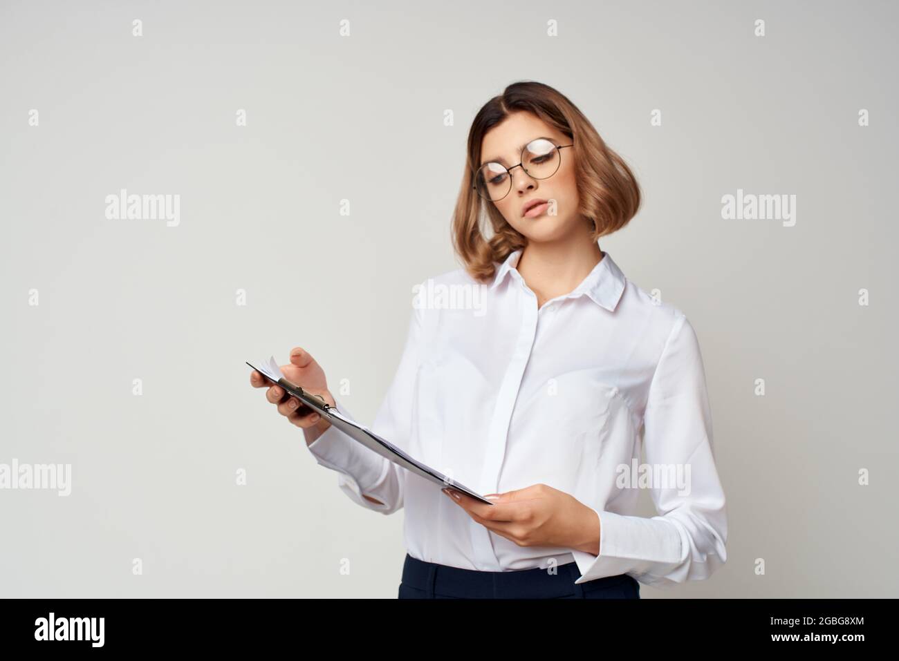 Business woman in white shirt work manager documents Stock Photo - Alamy