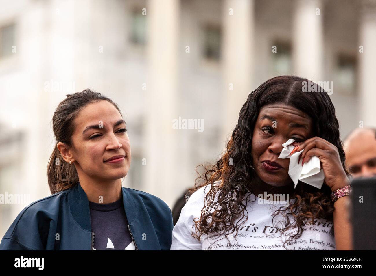 Washington, DC, USA, 3 August 2021.  Pictured: Congresswoman Cori Bush (D-MO) sheds tears of joy with Alexandria Ocasio-Cortez (D-NY) at a press conference announcing the Center for Disease Control’s new 60-day pandemic eviction moratorium at the Capitol.  Credit: Allison Bailey / Alamy Live News Stock Photo