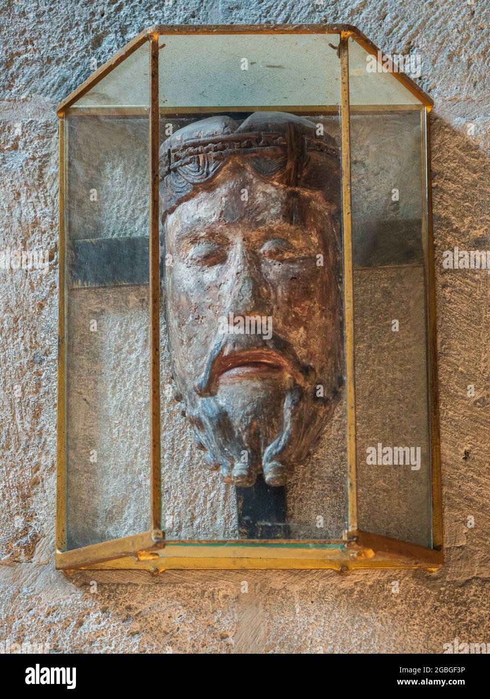 Reproduction of the head of 'Christ of Lavaudieu' statue of the 12th century. Abbey Church, Lavaudieu, Auvergne, France. Stock Photo