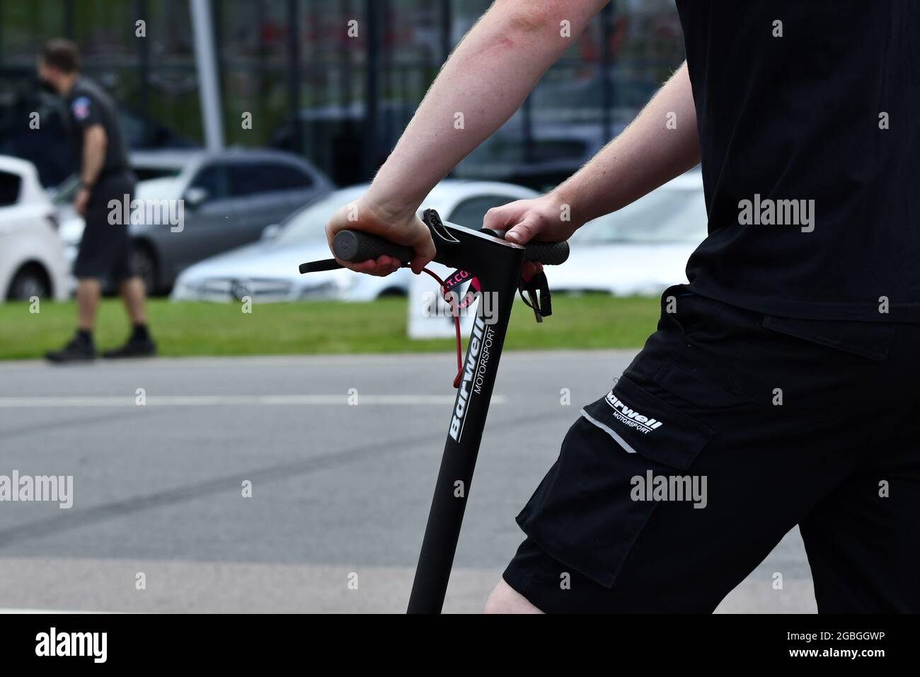 A partial view of a man on an e scooter UK Stock Photo