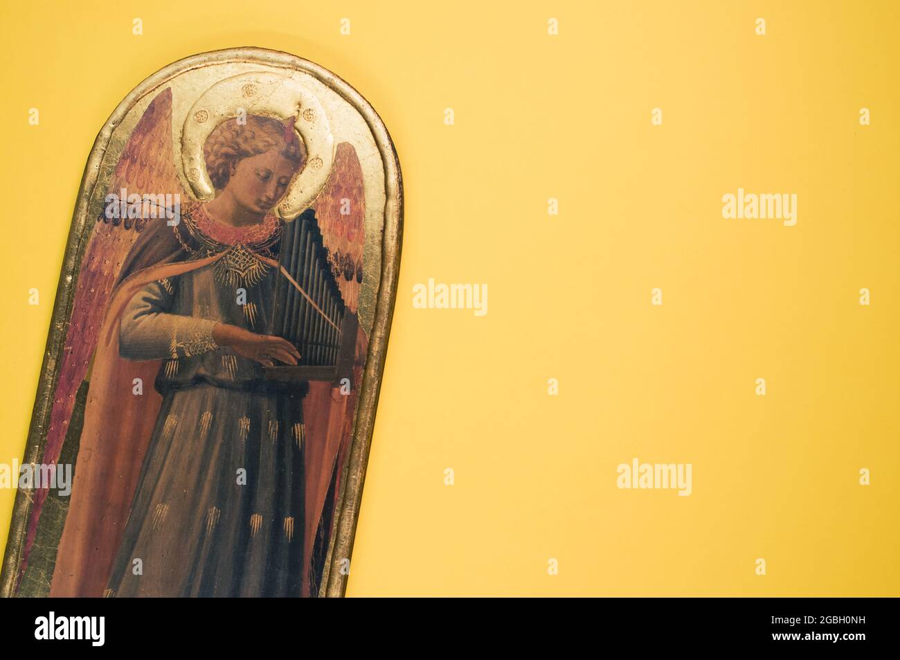 Common Angel String Instrument Angel ornament playing a string instrument on a yellow background with ...