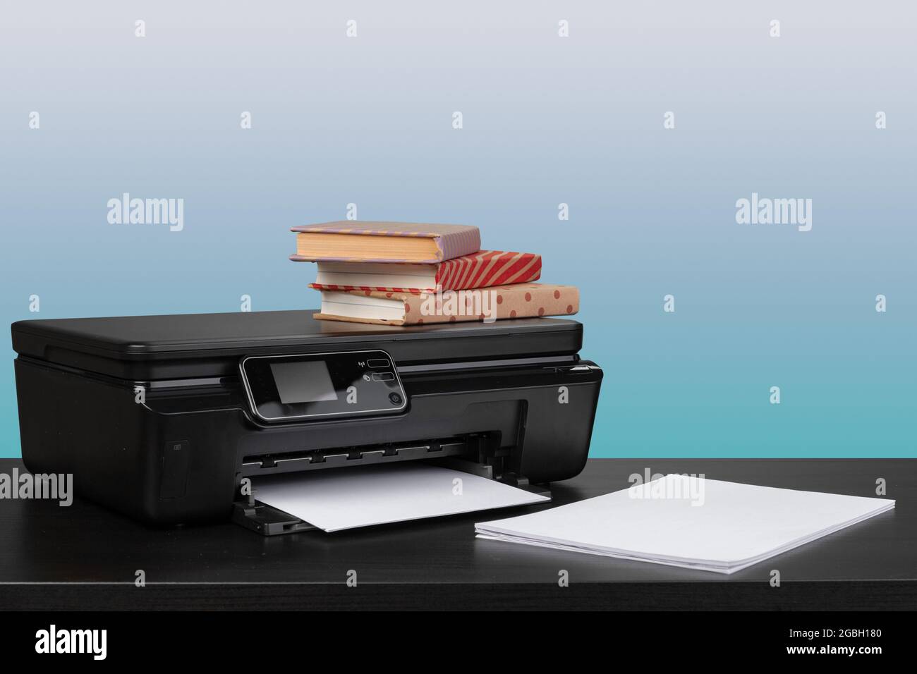 Compact home laser printer against gray background Stock Photo