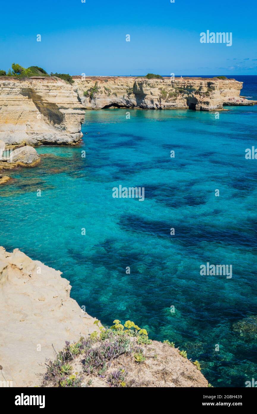 Torre Sant Andrea, Salento sea coast, Apulia, Italy. Faraglioni Melendugno. Beautiful rocky beach with cliffs in Puglia. Blue turquoise saturated clear water. Bright Summer day. No people. Stock Photo