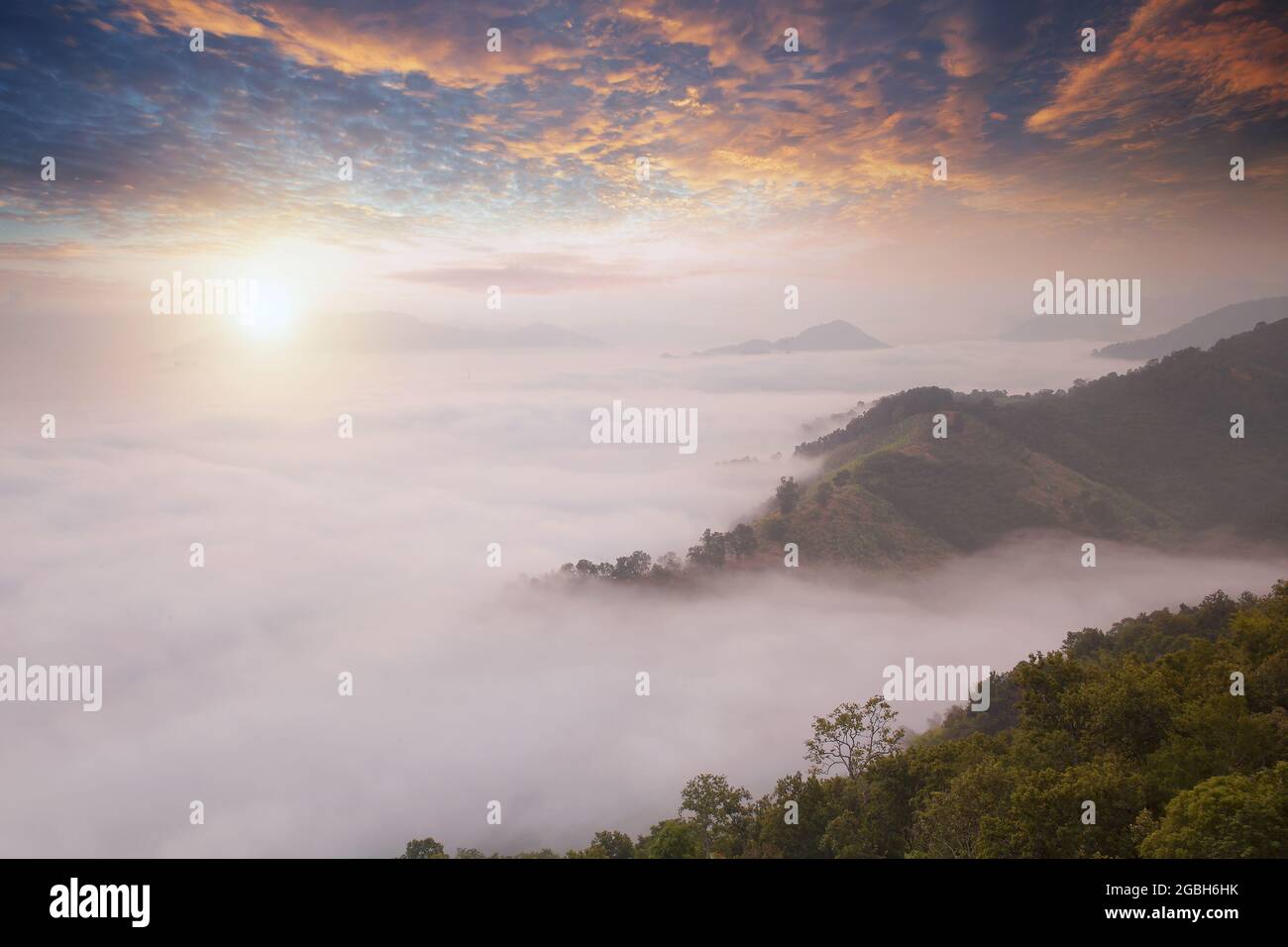Mountain landscape and cloud carpet at sunrise, Thailand Stock Photo