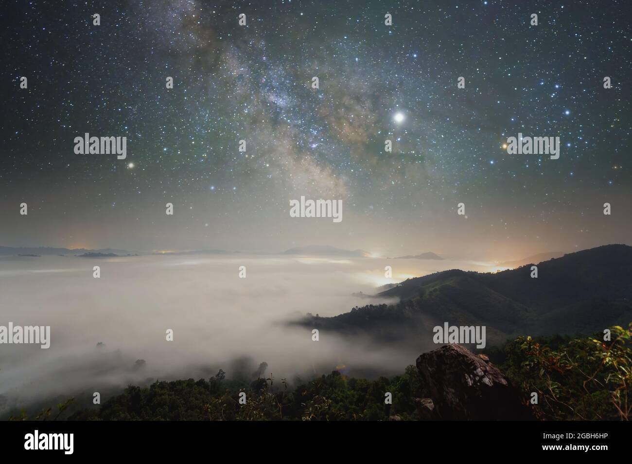 Milky way over a cloud carpet at night, Thailand Stock Photo