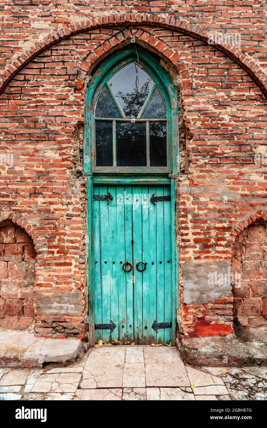 Antique wooden door of the entrance to mosque Stock Photo