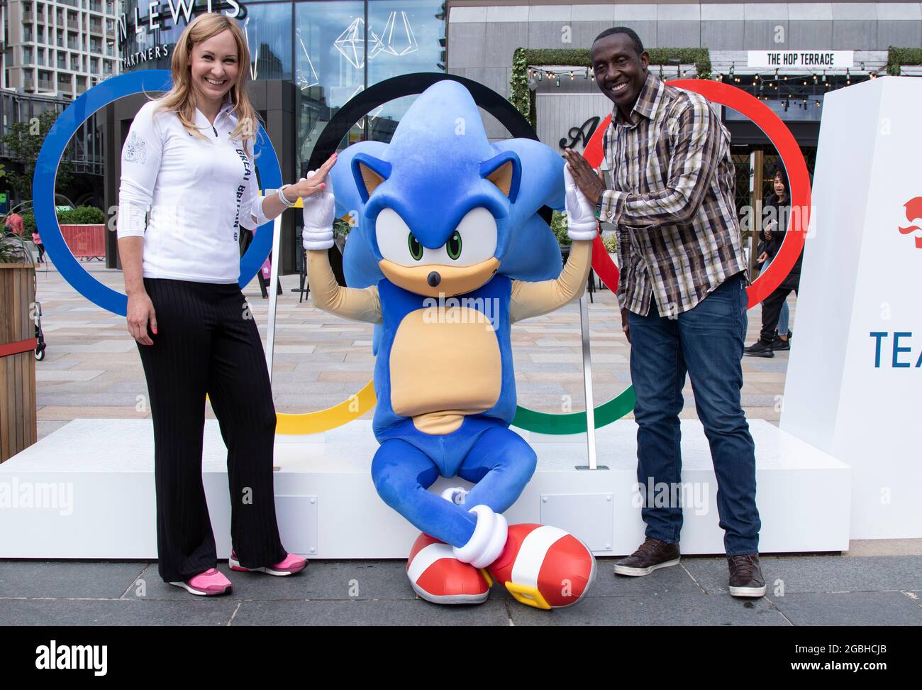 Team GB Athletes Joanna Roswell who is a double Olympic gold medalist in cycling and Linford Christie who is a gold and sliver medalist in sprinting, launch the Official Olympic game with the help of Sonic The Hedgehog at Team GB Fanzone at Westfield White City, West London, UK. Stock Photo