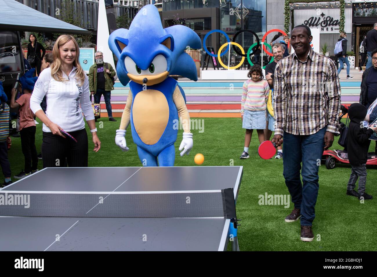 Team GB Athletes Joanna Roswell who is a double Olympic gold medalist in cycling and Linford Christie who is a gold and sliver medalist in sprinting, launch the Official Olympic game with the help of Sonic The Hedgehog at Team GB Fanzone at Westfield White City, West London, UK. Stock Photo