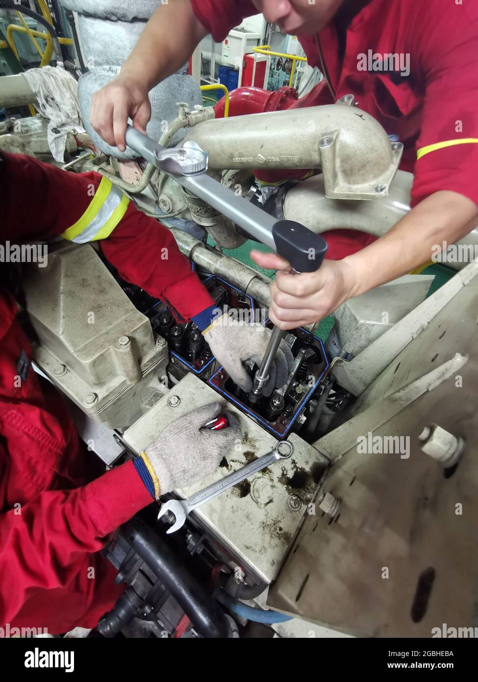 marine engineering crew carried out checking tappet clearance for auxiliary engine onboard as per plan maintenance system Stock Photo