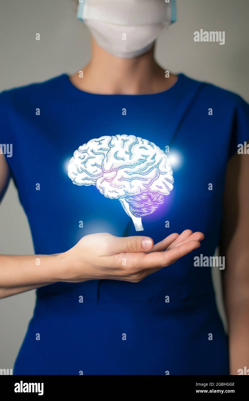 Woman in blue clothes holding virtual Brain in hand. Handrawn human organ, detox and healthcare, healthcare hospital service concept stock photo Stock Photo