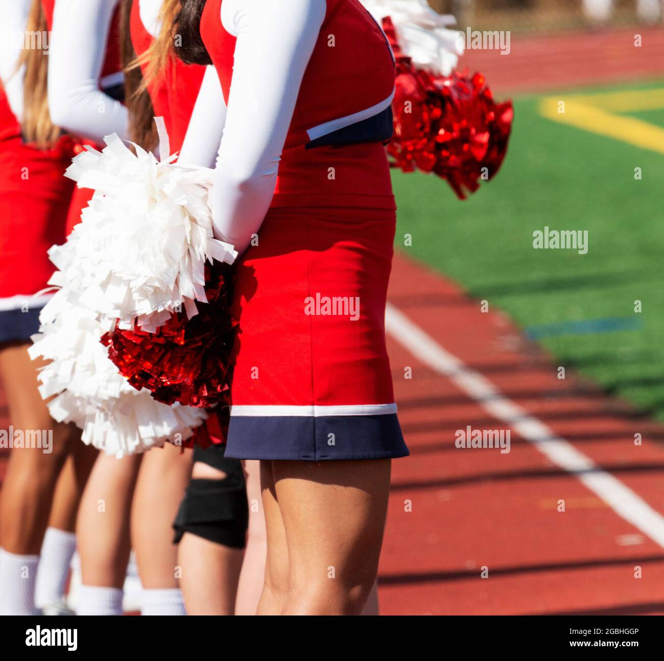 Portrait of cheerleader ( 8-9 years) holding pom-pom Stock Photo - Alamy
