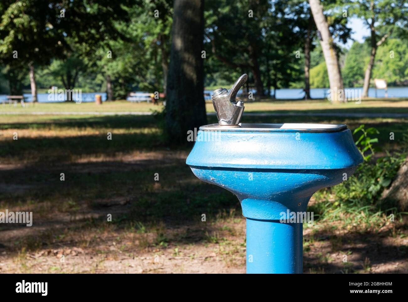 Top of a blue water fountain in Belmont Lake State Park Long Island New