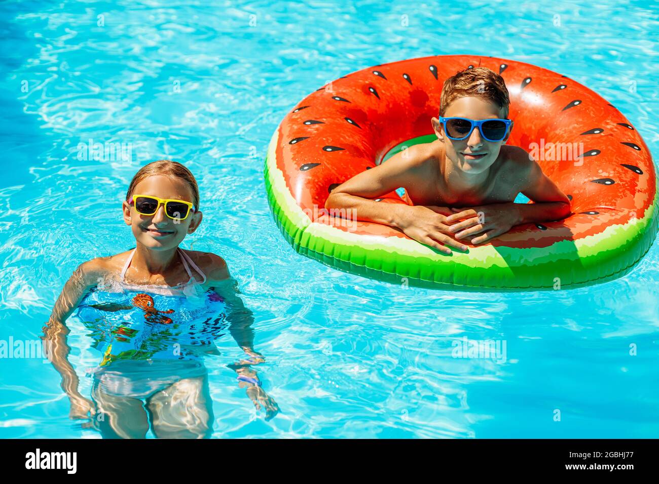 Kids playing with inflatable rings hi-res stock photography and images ...