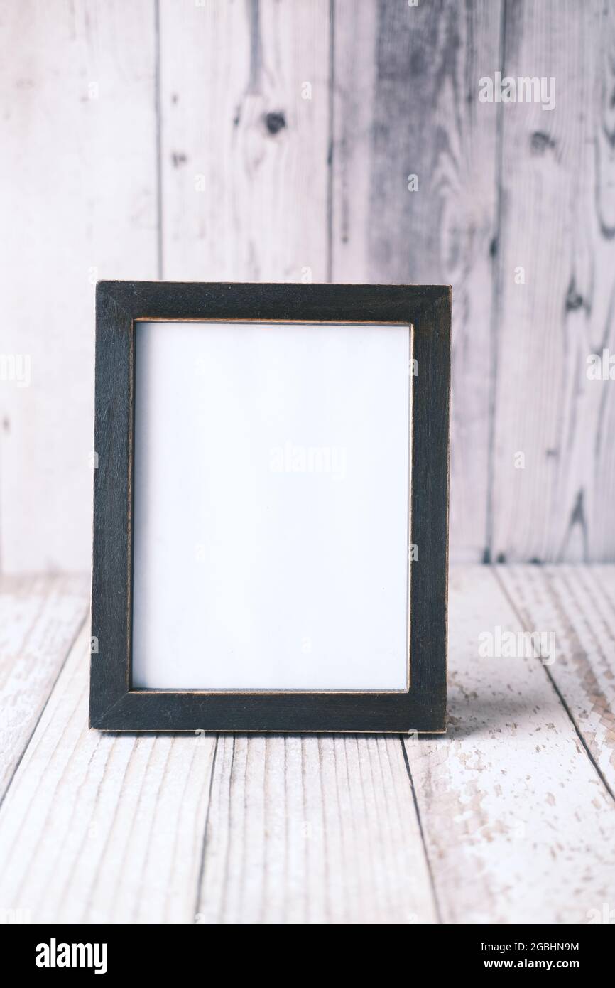 empty frame on wooden background . Stock Photo