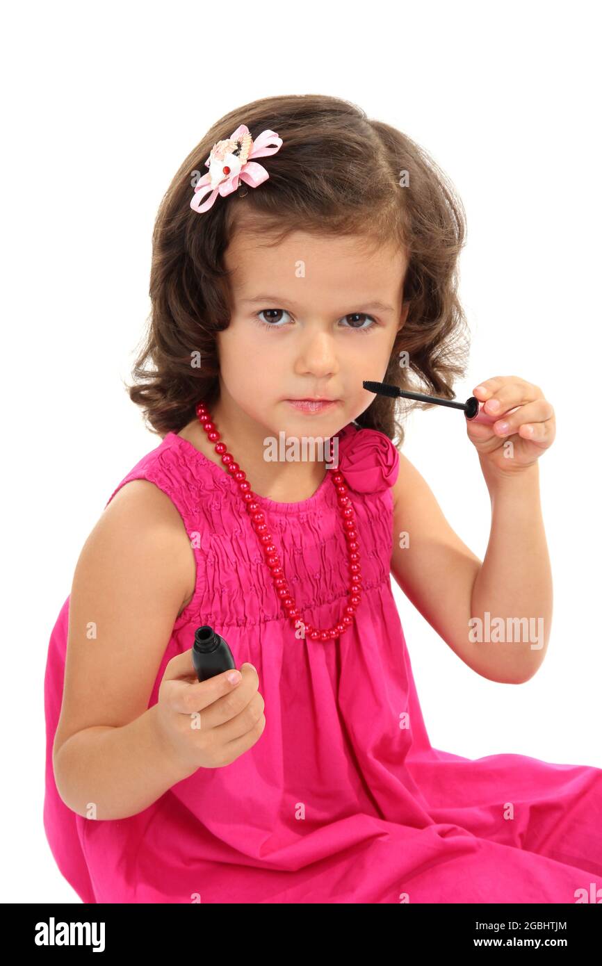 beautiful little girl doing makeup isolated on white Stock Photo Alamy