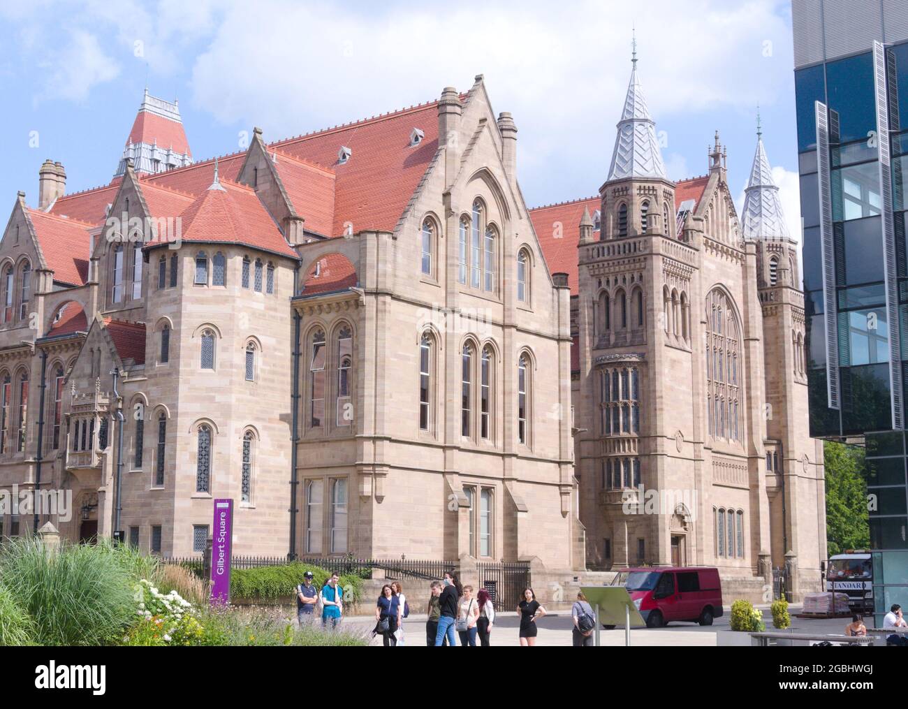 Christie Building in foreground, Whitworth Hall behind it, at University of Manchester, Manchester, England, UK Stock Photo
