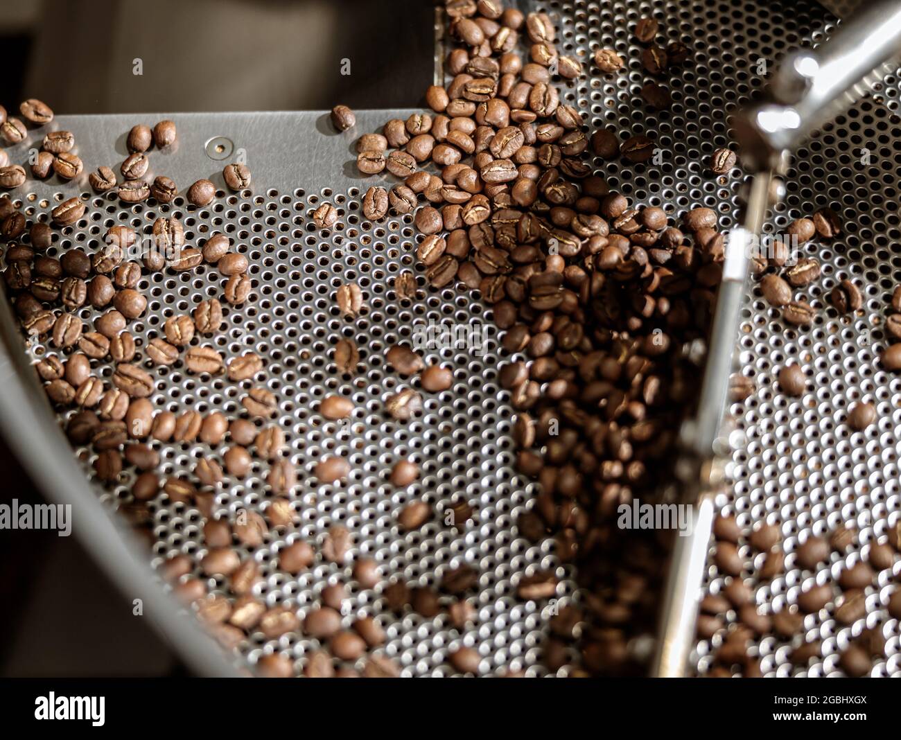 Cooling tray with freshly roasted coffee beans Stock Photo