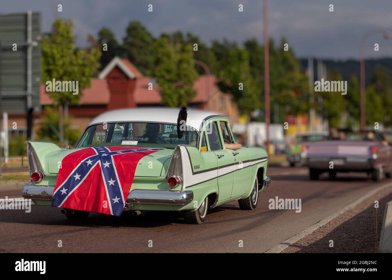 Rattvik, Sweden - July 27.2013: Classic Car Week Rttvik - 1958 back Plymouth Fury, flag Norway. Stock Photo