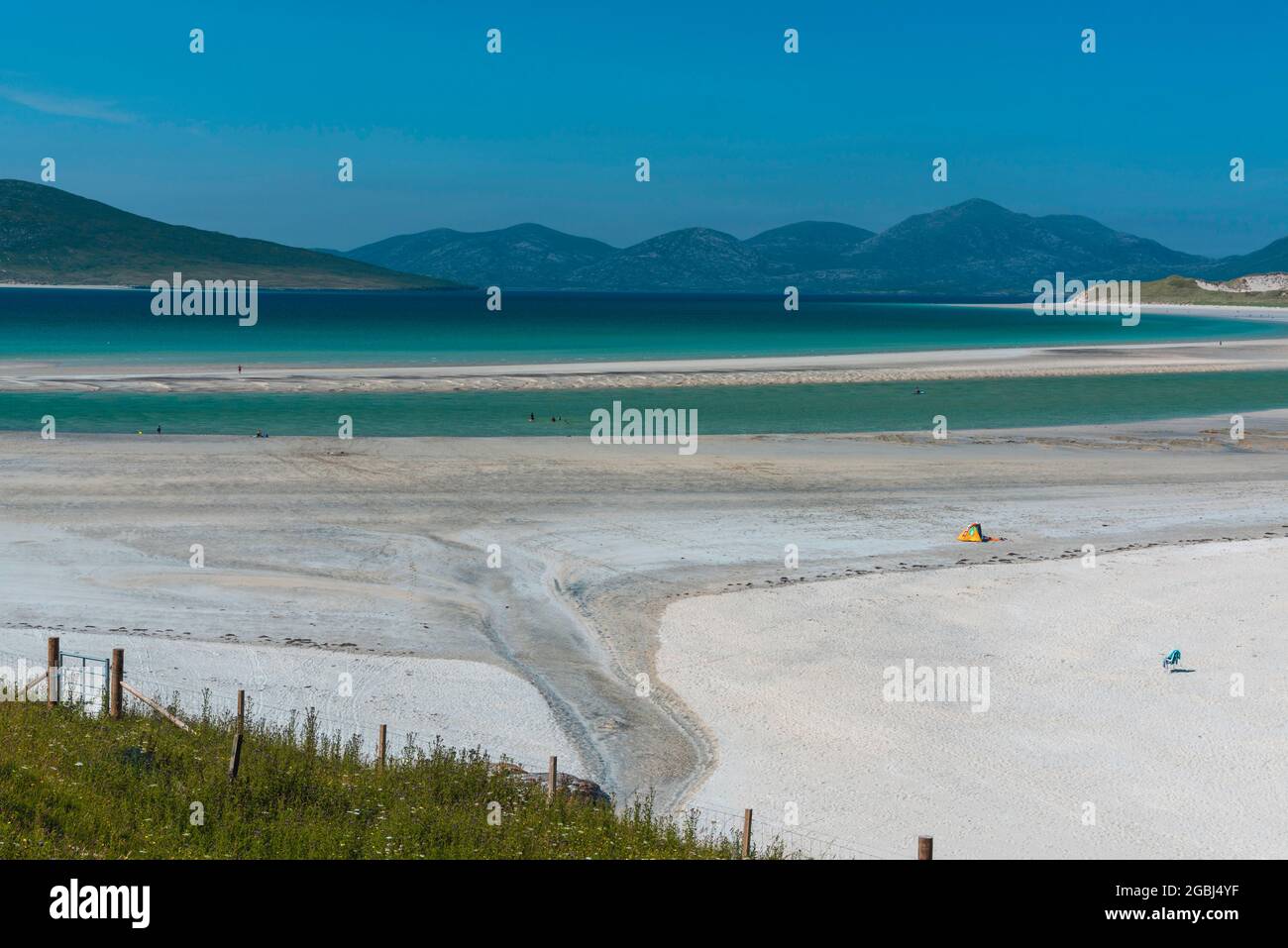 Looking across Seilebost beach to the hills of North Harris. The Isle of Taransay is on the left and Luskentyre beach is on the right. Stock Photo