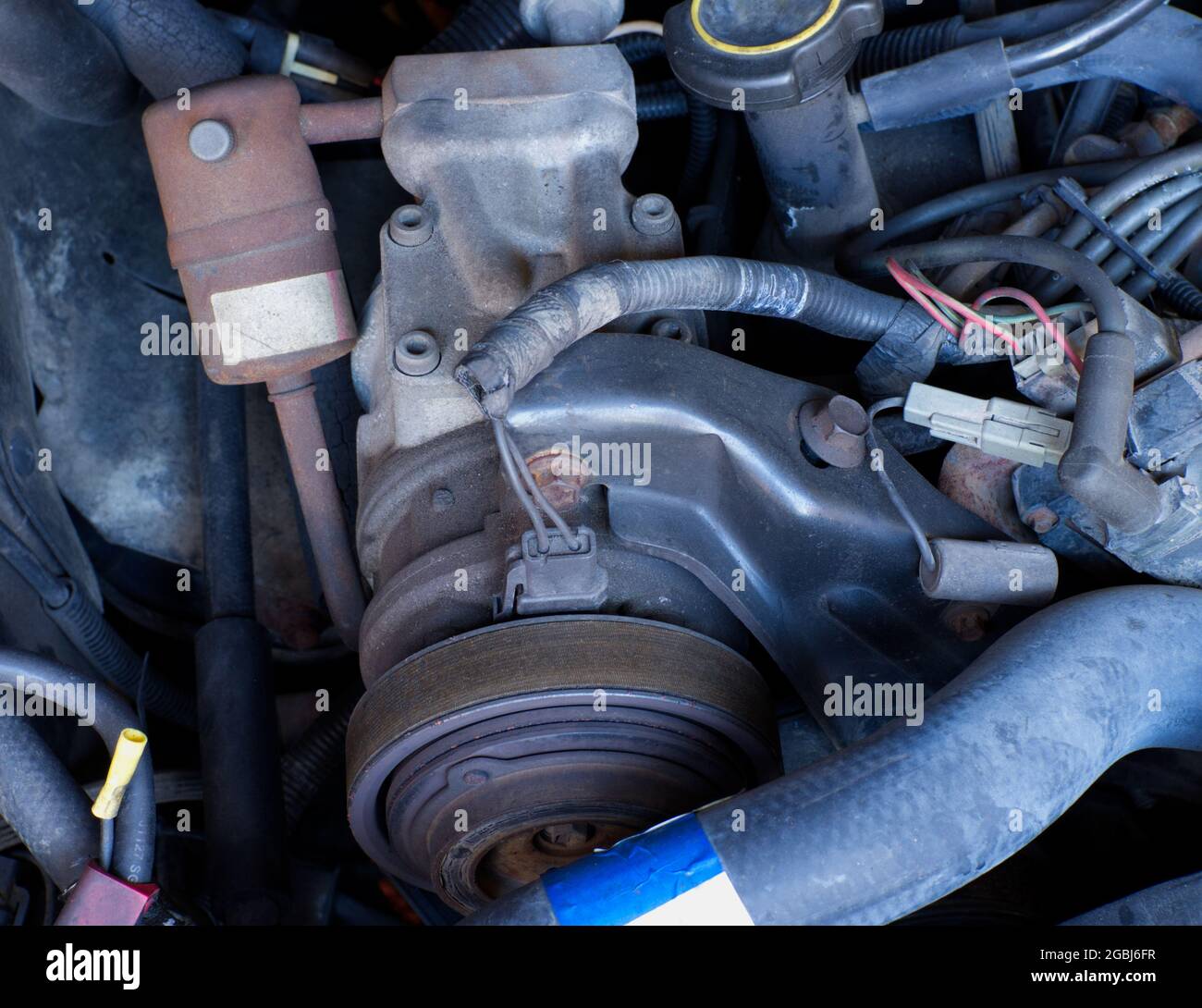 Air Conditioning Compressor on an Old Car Stock Photo