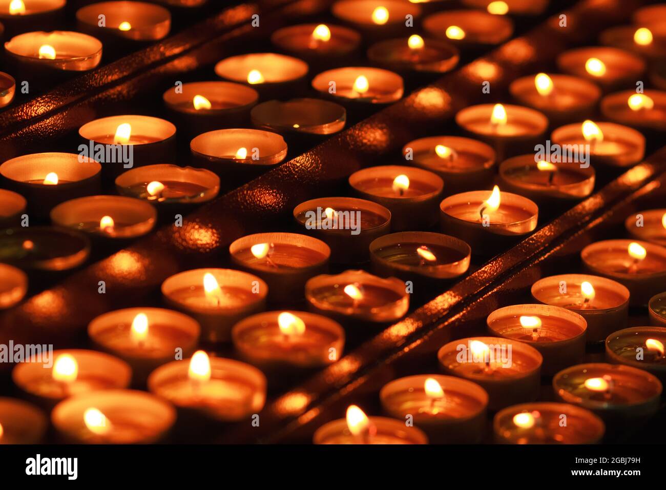 Rows Of Many Flames Of Candles. Church Traditional Pray Symbols. Fire