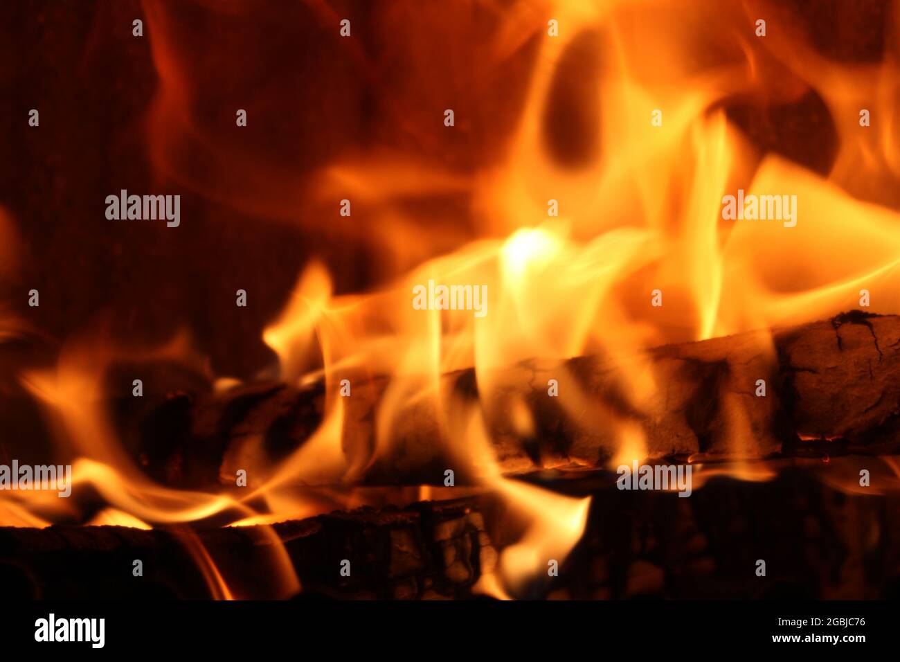 Macro shot of bonfire flame over the black background Stock Photo