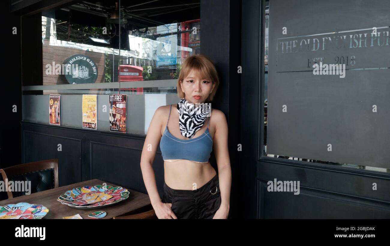 Asian Japanese Model out in front of Cafe on Thong Lo Bangkok Thailand Stock Photo