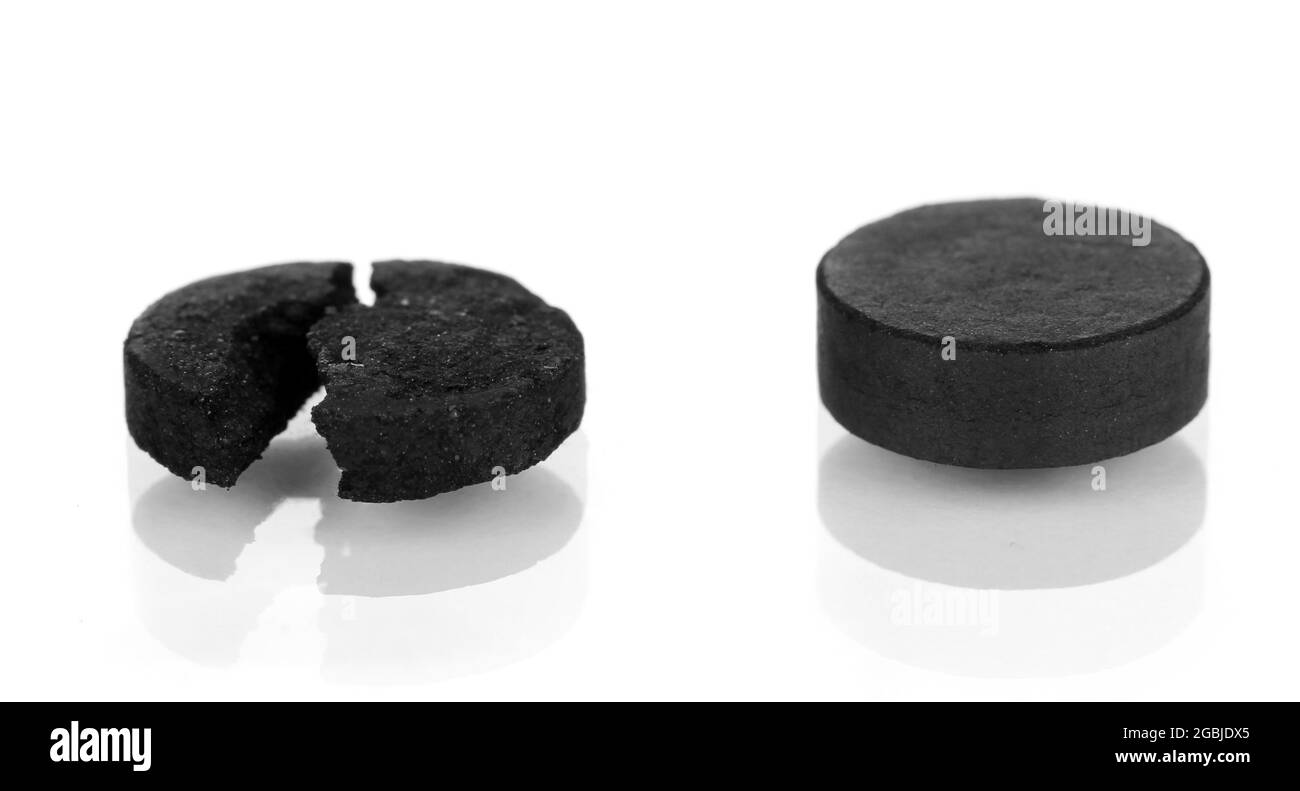 activated carbon in tablets isolated on white Stock Photo Alamy