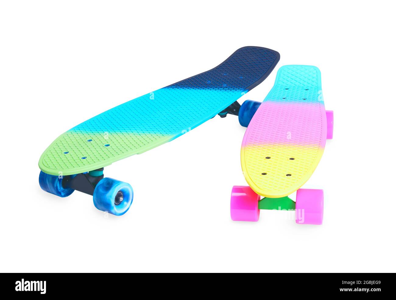 Two rainbow plastic Penny board skateboards on white background Stock Photo  - Alamy