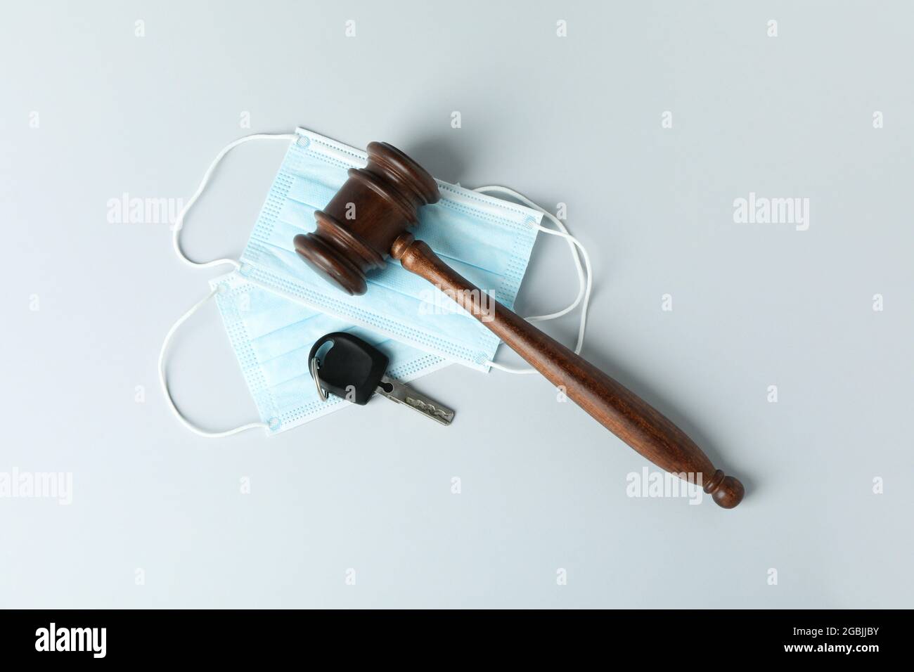 Judge gavel, key and medical masks on white background Stock Photo Alamy