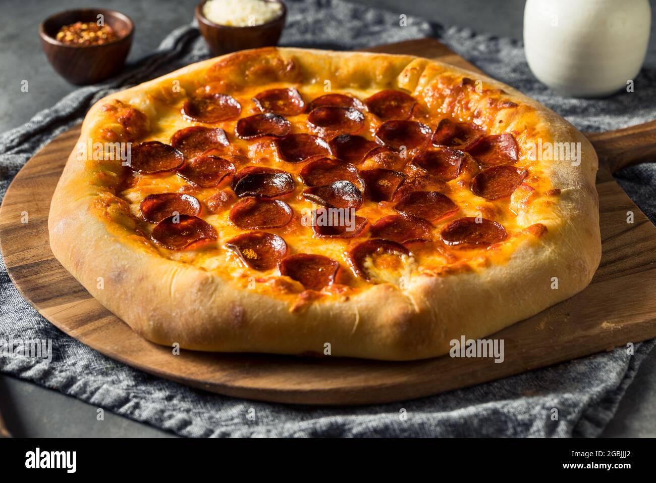 Homemade Pepperoni Stuffed Crust Pizza with Cheese Stock Photo