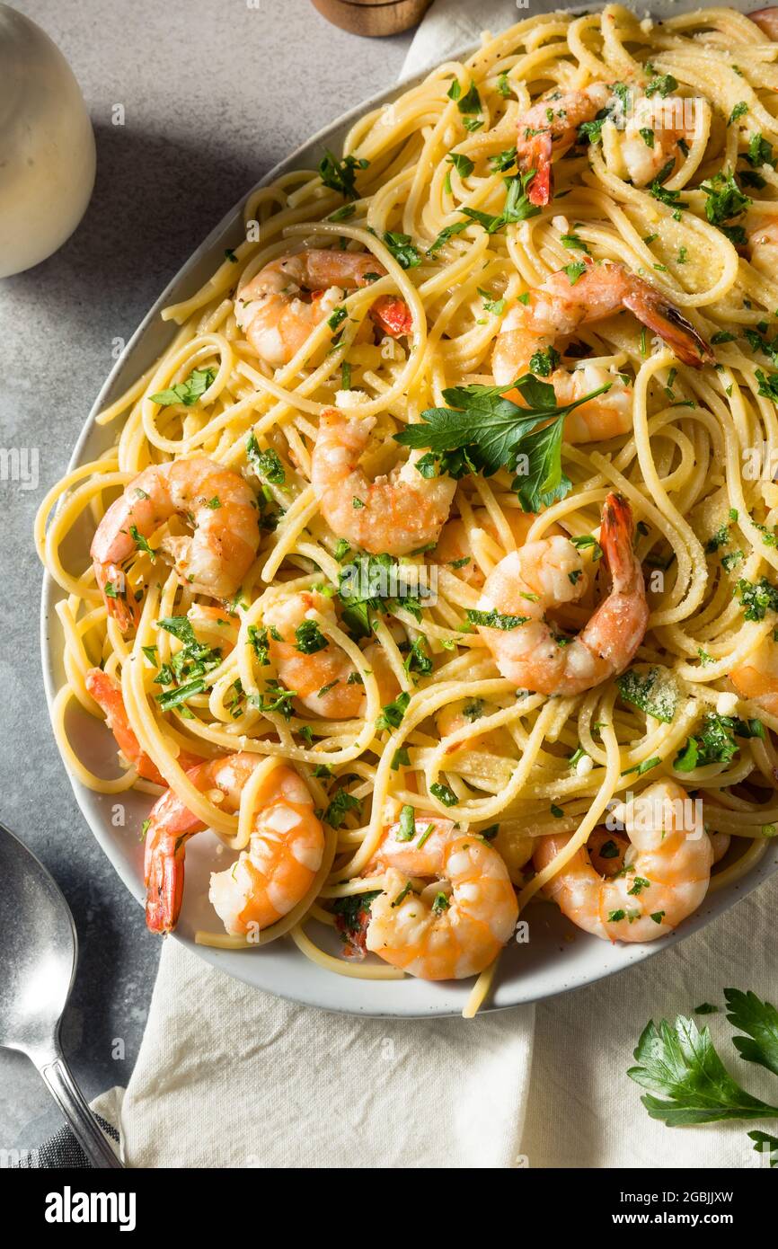 Homemade Cooked Shrimp Scampi with Pasta with Parsley Stock Photo
