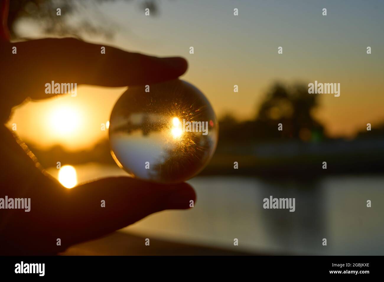 Beautiful sunset in the abstract misrepresentation of a glass ball in a ...