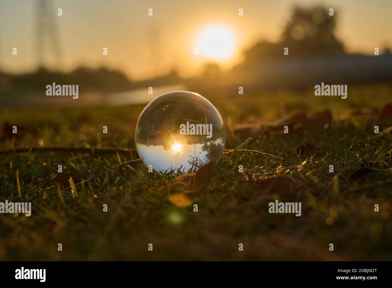 Beautiful sunset in the abstract misrepresentation of a glass ball ...