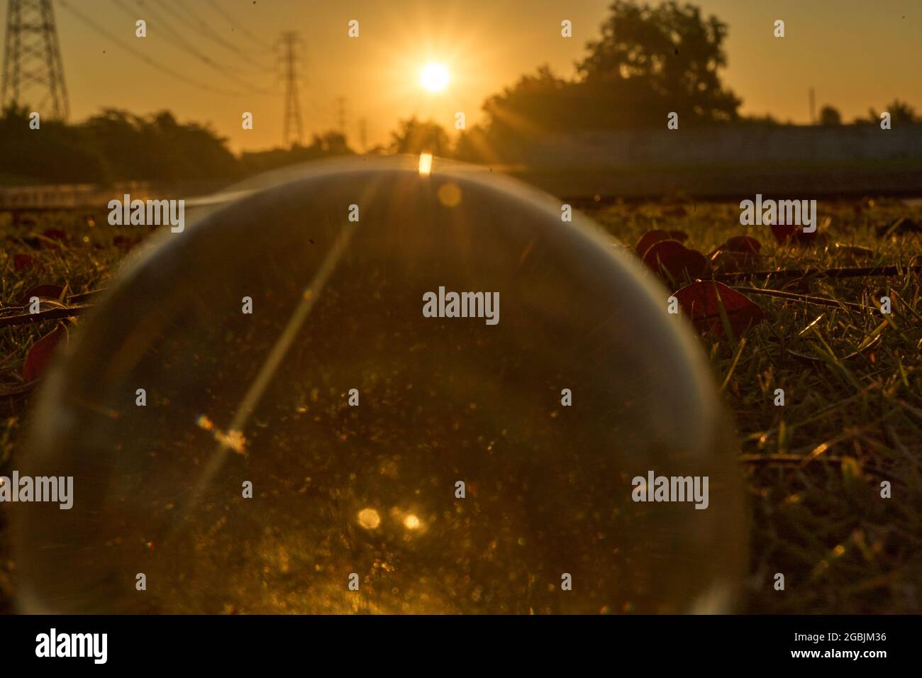 Beautiful sunset in the abstract misrepresentation of a glass ball ...
