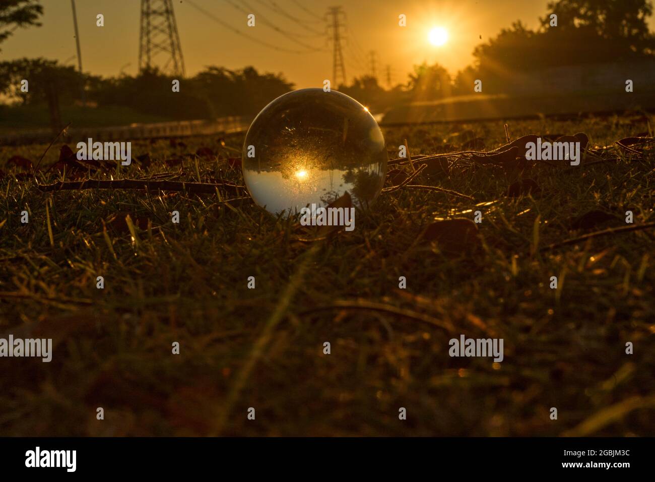 Beautiful sunset in the abstract misrepresentation of a glass ball ...