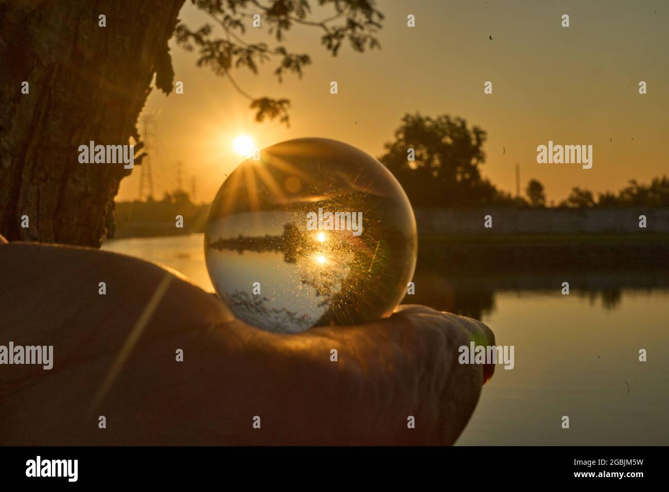 Beautiful sunset in the abstract misrepresentation of a glass ball ...