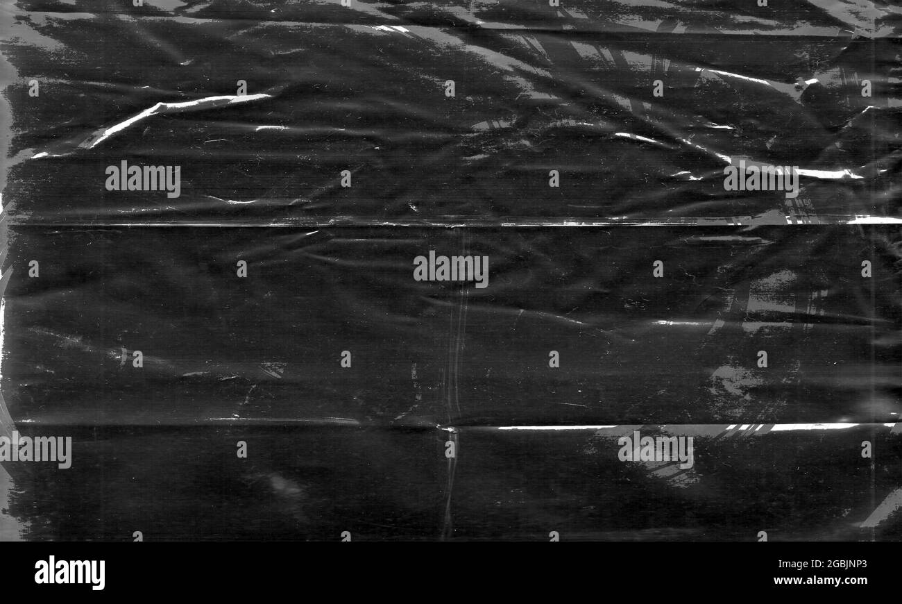 Background texture of a polyethylene,plastic transparent black plastic
