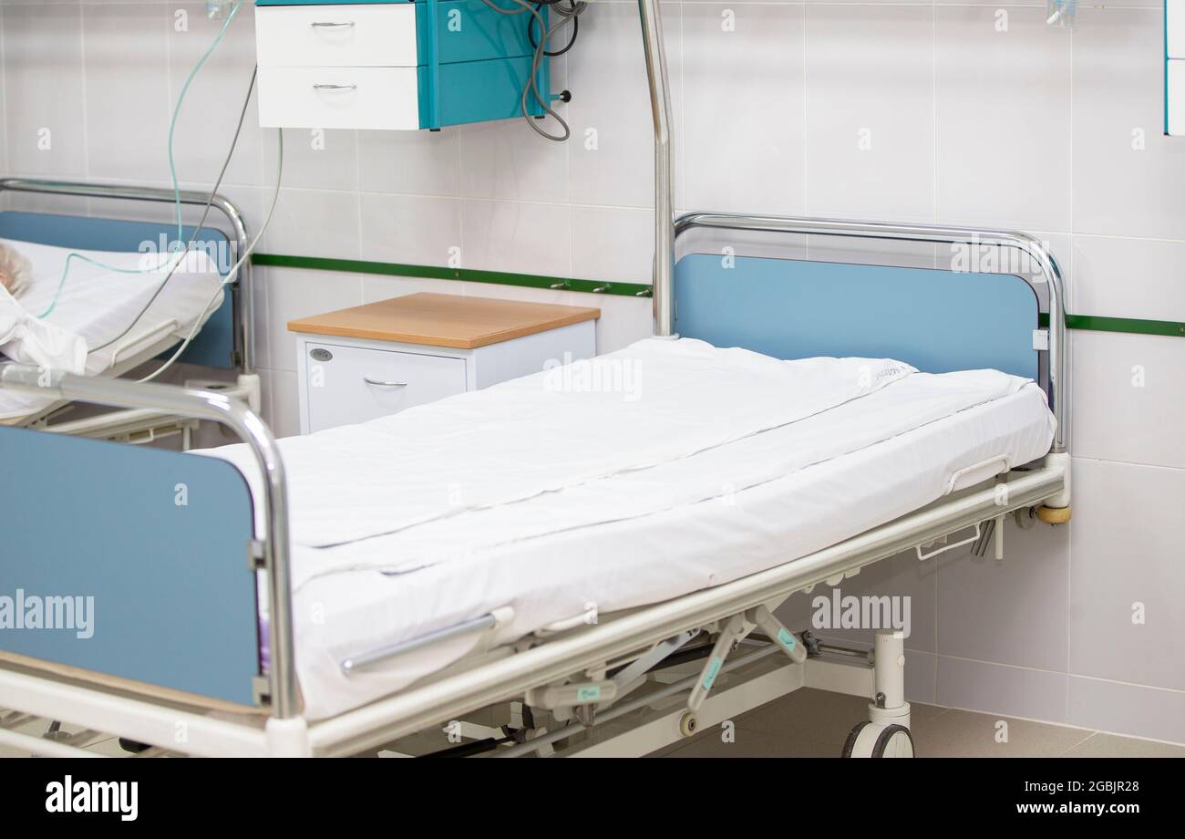 Part of a hospital ward or intensive care unit with a bed. Stock Photo