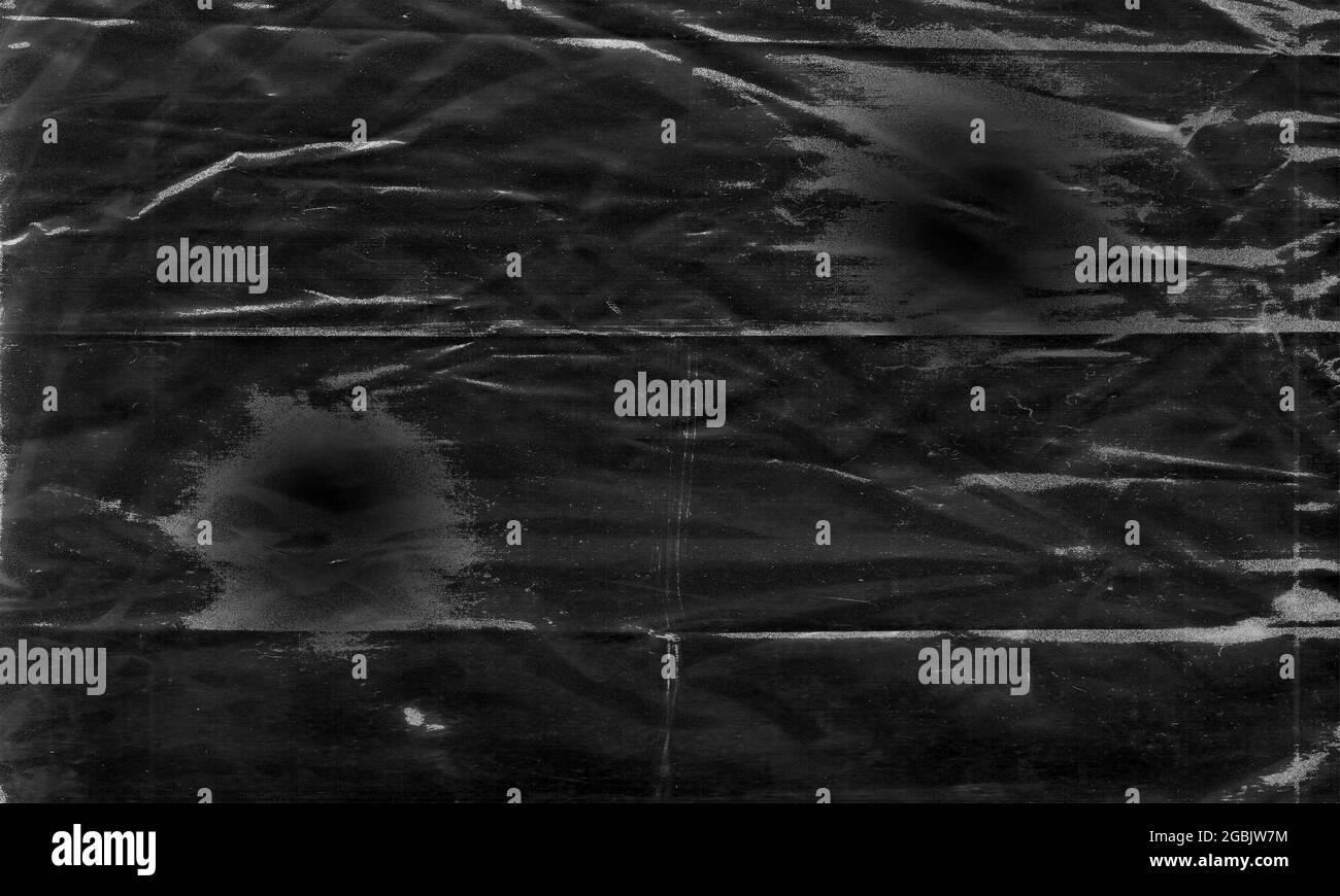 Background texture of a polyethylene,plastic transparent black plastic