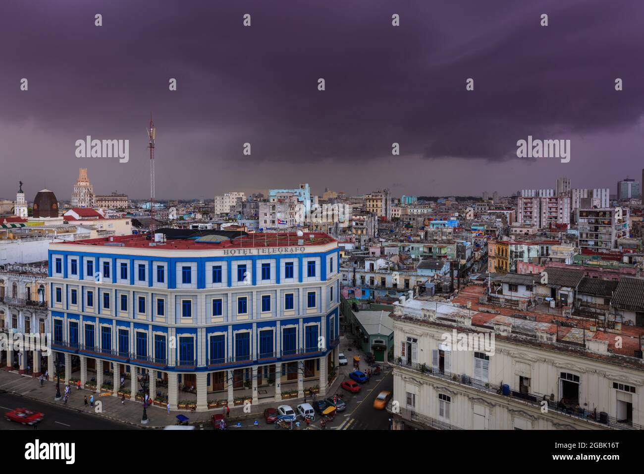 Thunder storm and rain clouds above Havana rooftops and Hotel Telegrafo in Habana Vieja, Old Havana, Cuba Stock Photo