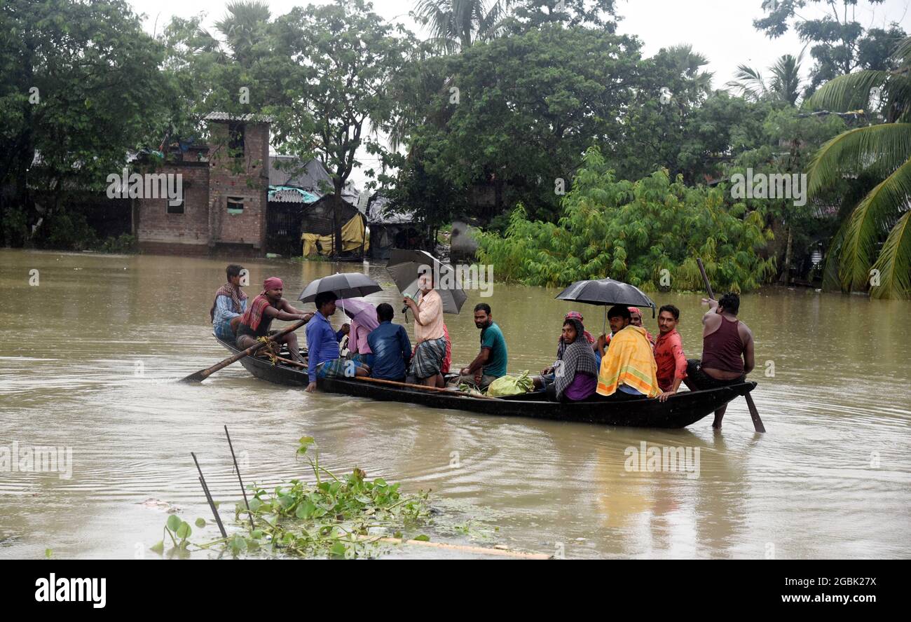 West Bengal. 4th Aug, 2021. Villagers take a boat on floodwaters to a safer place in Hoogly district of India's West Bengal State on Aug. 4, 2021. Credit: Str/Xinhua/Alamy Live News Stock Photo