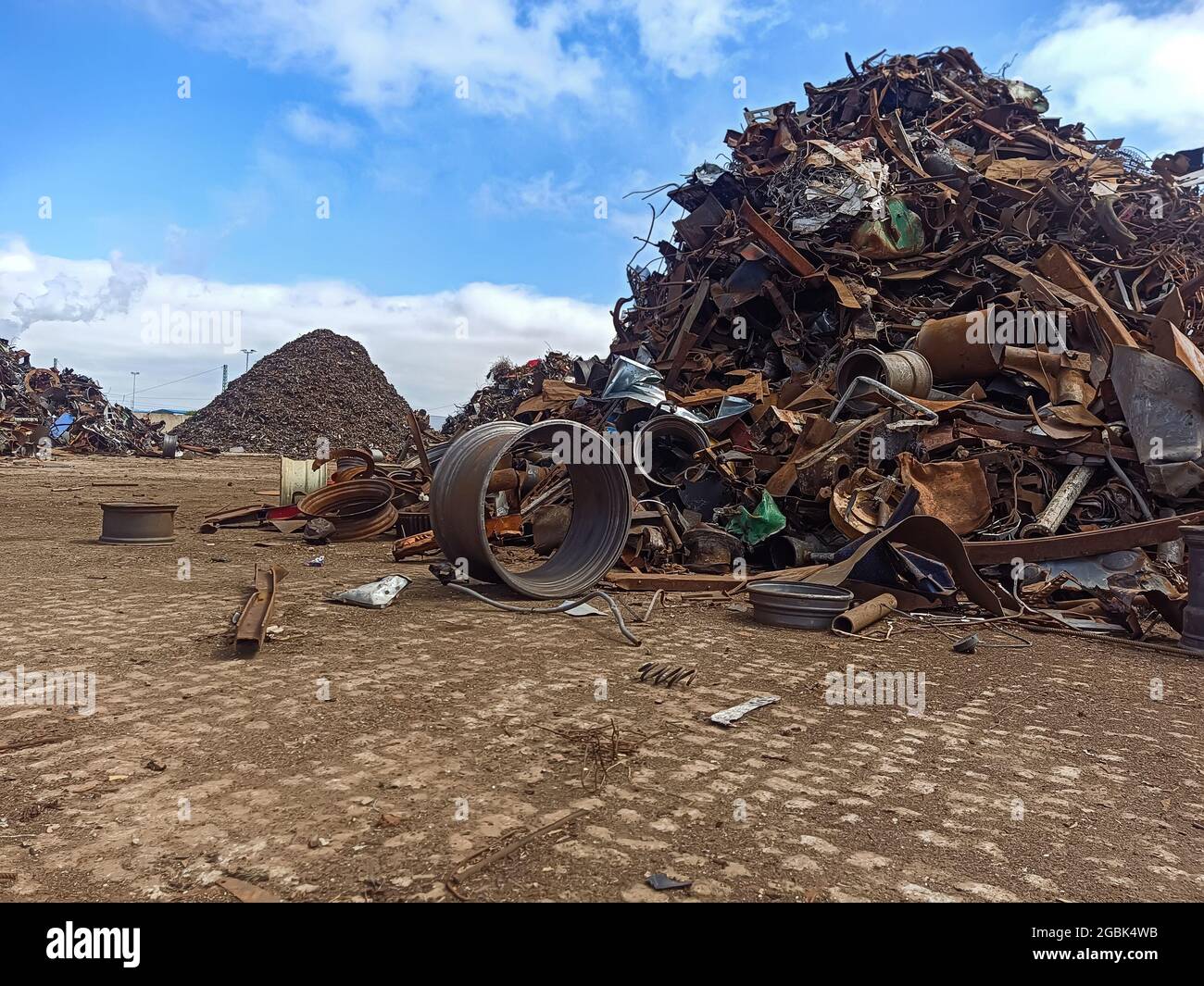old rims and scrap metal at the port for shipment to the ship for