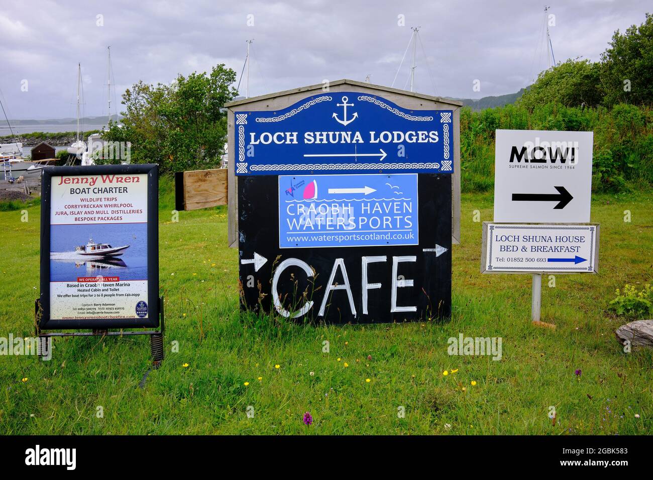 Advertising boards at the entrance to Craobh Marina on the Craignish Peninsula. Scotland Stock Photo