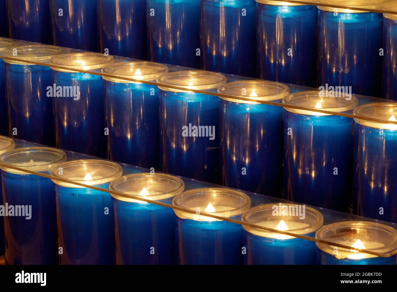 Prayer candles burning inside a church in Northern California Stock