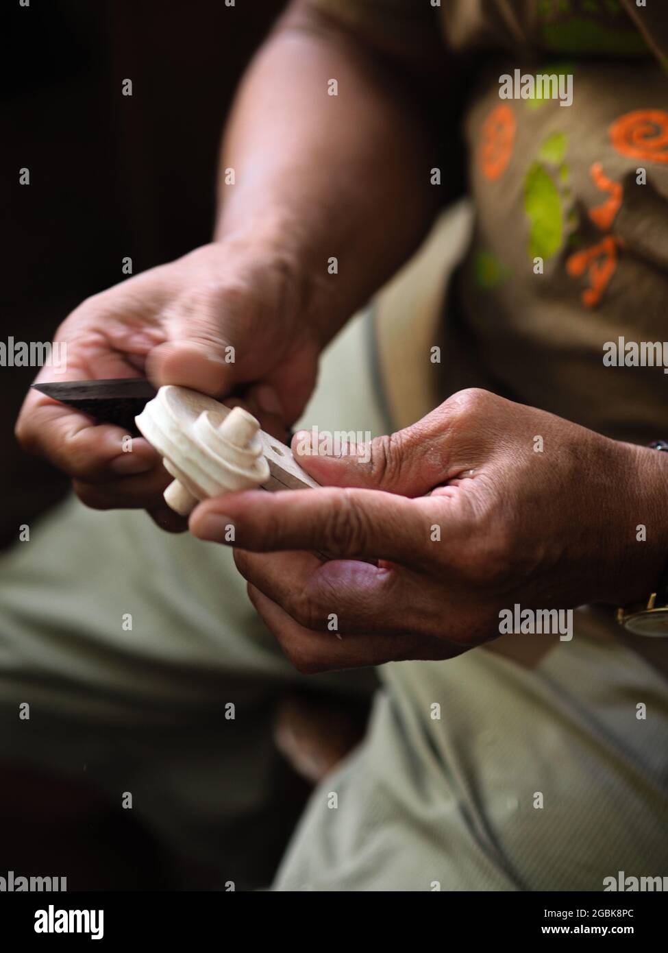 Luthier working on violin head and curl Stock Photo