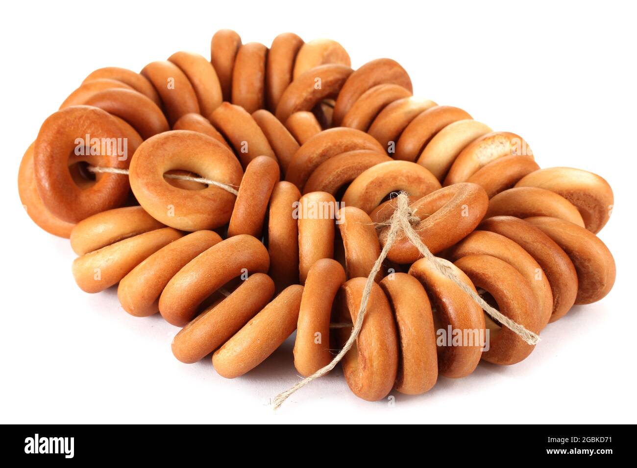 tasty bagels on rope, isolated on white Stock Photo - Alamy
