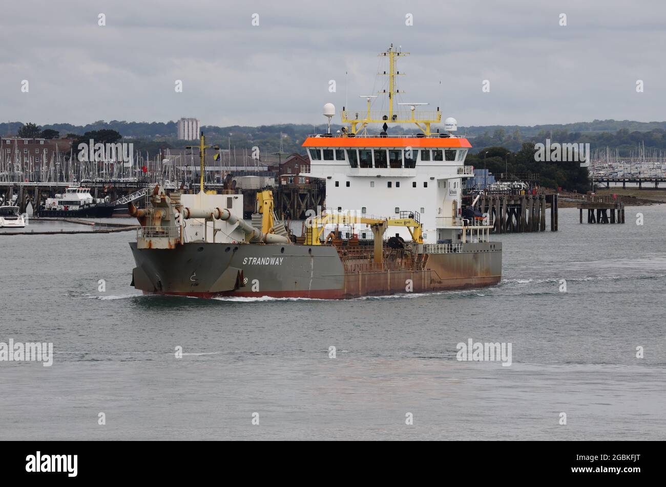 The Cypriot registered hopper dredger STRANDWAY heads out of the harbour after completing work in and around the Naval Base Stock Photo
