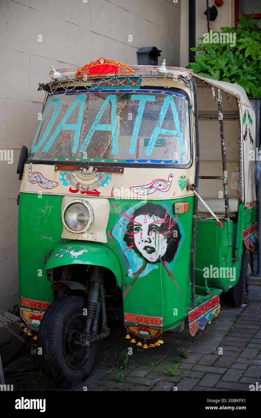 GREYSTONES, IRELAND Jul 02, 2021 Vertical shot of an old auto rickshaw used as an
